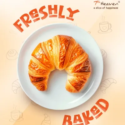 A close up of our classic croissant, baked fresh with love. The golden-brown crust and light, airy layers make it the perfect companion for your morning coffee or an afternoon snack.