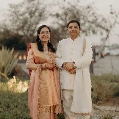 A portrait of the parents of the bride, looking elegant and proud. We styled them in coordinated classic attire, ensuring they felt comfortable and celebrated as they fulfilled their duties.