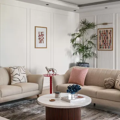 The living room in Project Dolce is a study in modern comfort. I used a neutral color palette with pops of red and blue, and mixed textures like the fluted coffee table base and soft upholstery to create a space that is both stylish and inviting.