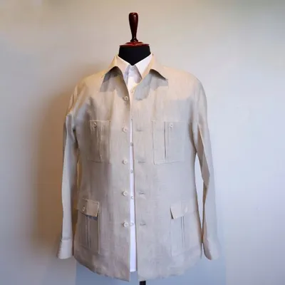 Made from high-quality linen, the cream-white hue of this overshirt adds a touch of understated luxury to any ensemble.