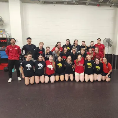 Leading a training session with the talented York University women's hockey team. This experience was instrumental in learning how to apply S&C principles to the specific demands of a fast-paced, high-skill team sport.