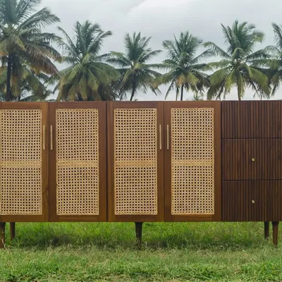 Part of the Ballygunge Console Series, this bespoke unit was designed for a home in Kolkata. It combines closed rattan-paneled cabinets with open shelving and fluted wooden drawers, offering a variety of storage options.