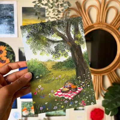 Picnic date anyone? This gouache painting captures a perfect cottagecore moment, held up against the backdrop of my studio.