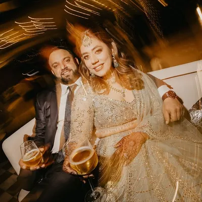 A stunning portrait of the couple at their cocktail party, captured with a creative light trail effect. This shot is full of energy, glamour, and a touch of magic.