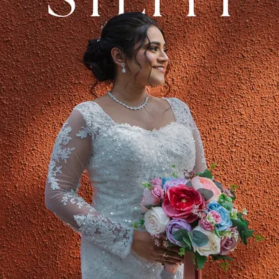 My beautiful Catholic bride Steffi, radiating elegance in her white lace bridal gown. We created a flawless soft-glam makeup look and styled her hair in a delicate updo with a tiara.