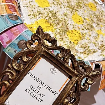 Our famous 'Chandni Chowk Se Daulat Ki Chaat,' a light and airy dessert, presented with a creative flair that delights guests and evokes the spirit of Old Delhi.