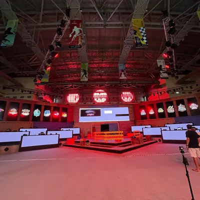 The full setup for a major e-sports tournament, with individual gaming stations arranged on the main floor. This shows our capacity to host large, multi-player gaming events.