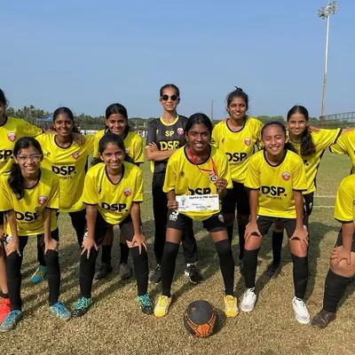 This is the look of a team that left everything on the field. Our girls squad in their yellow jerseys, posing together after a tough match at a tournament, showcasing their unity and fighting spirit.