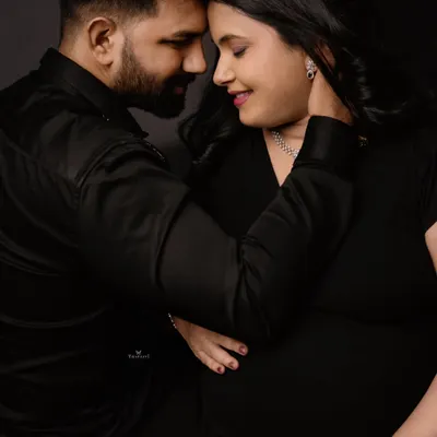 A powerful and intimate close-up of a couple. This shot focuses on the deep connection and quiet love between them as they prepare to become parents.