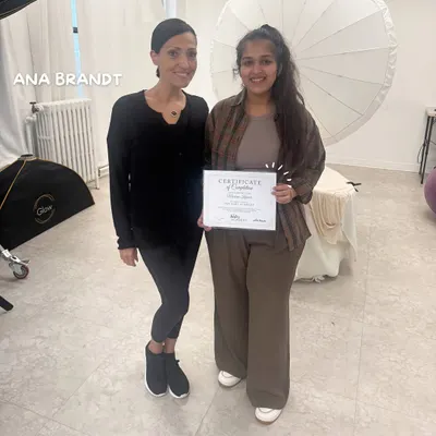 Here I am, holding my certificate of completion after training with the world-renowned newborn photographer Ana Brandt in New York. This investment in my craft ensures I bring international standards of safety and artistry to your session.