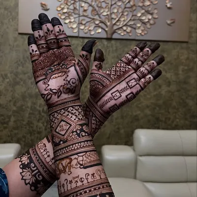 A special mehendi for a baby shower, featuring a cradle and other baby-related motifs to celebrate the mom-to-be.