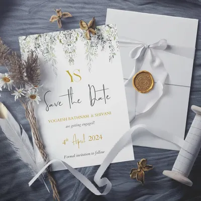 A Save the Date that is pure enchantment. This design for Yogaesh and Shivani blends a golden monogram and text with delicate watercolor leaves, creating a look that is both modern and timelessly romantic.