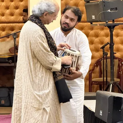 A precious moment with my Guruji, Pandit Yogesh Samsi ji. He is not just my teacher but my guide in music and in life. Here he is inspecting my tabla, a simple act that holds deep meaning for me.