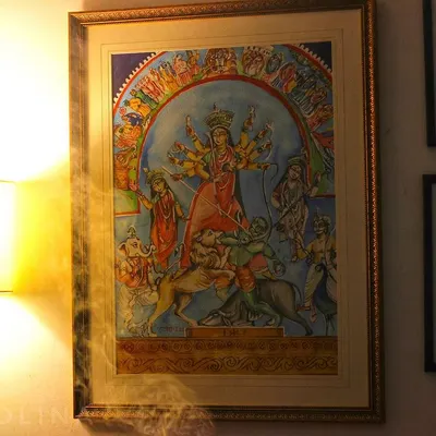 A detailed painting of Ma Durga, capturing her divine energy. This piece is now framed and part of a beautiful home, bringing the festive spirit of Durga Puja all year round.