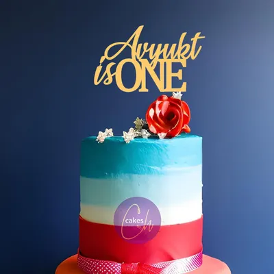 This colorful, multi-layered cake for Avyukt's first birthday is finished with a simple and elegant gold acrylic topper. The clean font is versatile and works well with any cake design.