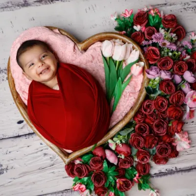 A smile that outshines the brightest flowers. I love creating these heart-shaped floral arrangements to cradle your baby in beauty.