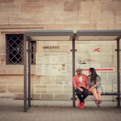 A quiet moment shared by a couple at a bus stop in Germany. This destination shoot shows our ability to tell love stories anywhere in the world, finding romance in ordinary places.