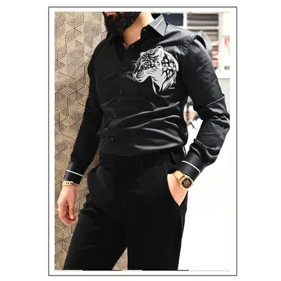 A custom-designed black shirt featuring a handmade printed tiger motif. This is for the client who wants a unique piece that is both stylish and bold.
