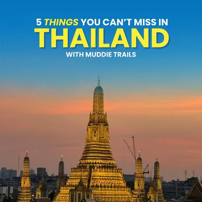 This is the cover for my "5 Things You Can't Miss in Thailand" guide, featuring the stunning Wat Arun temple in Bangkok. The city is a mix of ancient culture and modern life.