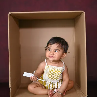A simple box, a cute outfit, and a happy baby. Sometimes, that's all you need for a great photo!