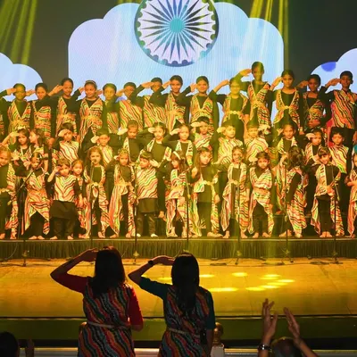 A powerful moment from our 'Sakhya 2025' concert, where our student choir performs a patriotic song, saluting in unison. This performance at the Royal Opera House was a culmination of months of dedication and teamwork.
