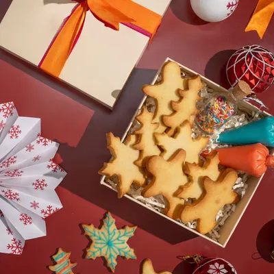 My DIY Cookie Kit is a super fun family activity. It comes with Christmas-themed sugar cookies, two piping bags of royal icing, and a jar of sprinkles for that magic touch.