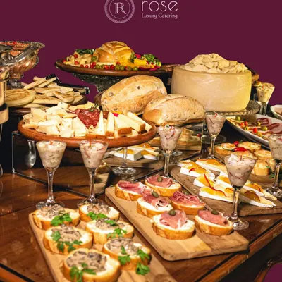 A lavish spread of artisanal breads, assorted cheeses, and cured meats. This grazing table is a feast for the eyes and the palate, offering a sophisticated and communal dining experience for your guests.