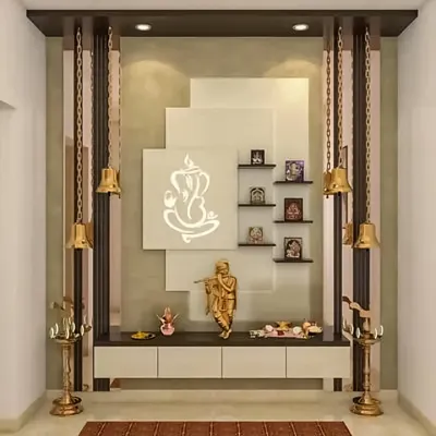We designed this contemporary pooja unit with a backlit Ganesha motif as the centerpiece. The design includes floating shelves for idols, hanging brass bells, and a low-profile cabinet for storing prayer essentials, creating a modern and divine space.