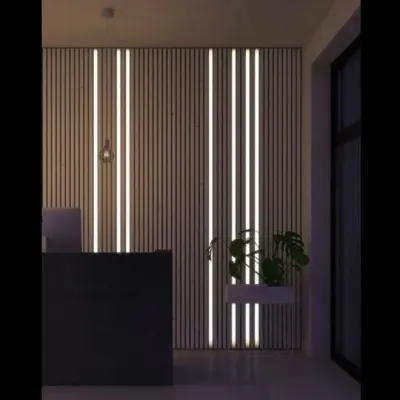 This is a custom-designed feature wall with vertical wood slats and integrated LED strip lighting. This design not only acts as a stunning visual element but also provides ambient light, perfect for a modern reception or lounge area.