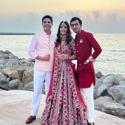 Posing with the wonderful couple against a beautiful sunset at their beach wedding. Their smiles and the stunning backdrop made this a truly memorable event.