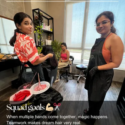 Teamwork makes the dream hair happen. Here you can see students collaborating during a live model session, learning how to work together to achieve a flawless color application.