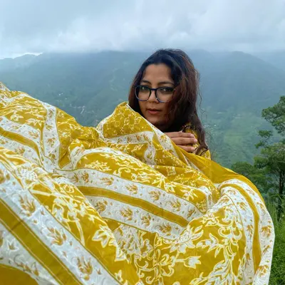 A self-portrait in the mountains, using my dupatta to play with the wind. This is about finding strength and holding your head up, a core part of my personal journey.