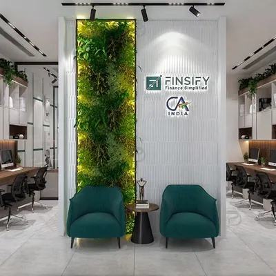 A 3D render of a vibrant CA office, featuring a central green wall that serves as a natural focal point. The design includes open-plan workstations and comfortable breakout seating to encourage interaction and well-being.