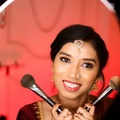 A fun and creative shot of the bride-to-be, Lavanya, for her ring ceremony. Her makeup is fresh and bright, perfect for this happy occasion.