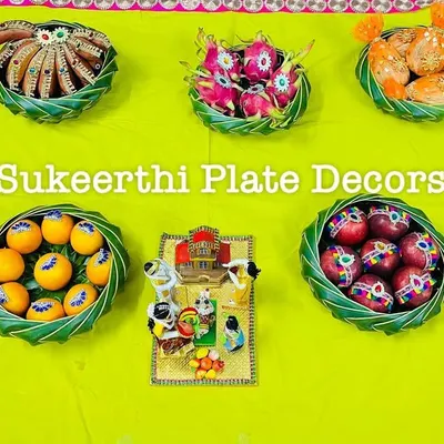 A lovely platter arrangement for a housewarming ceremony in Sirumugai. The platters are filled with auspicious items like fruits and sweets to bring good fortune to the new home.