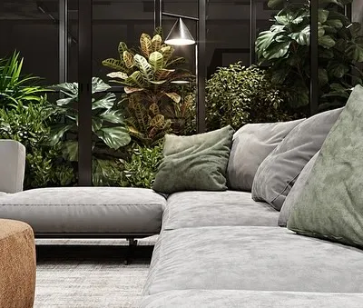 A close-up of a comfortable sofa set against a backdrop of a lush, enclosed indoor garden. This design brings the restorative feeling of nature right into the living area without sacrificing comfort or space.