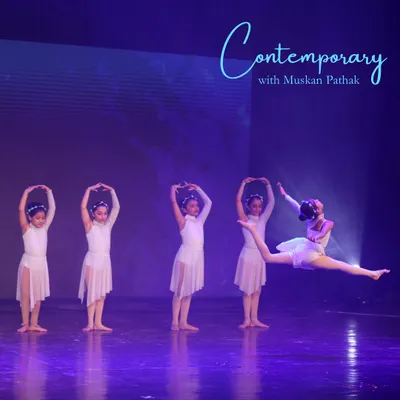 A breathtaking leap captured during our kids' contemporary performance. Our annual showcase gives young dancers the chance to experience the thrill of performing on a grand stage.