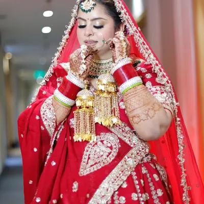 A moment of quiet reflection for my beautiful bride Preeti. Her royal and regal look was completed with a stunning red lehenga and traditional jewellery.