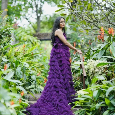 A beautiful solo shot of the bride-to-be in our purple ruffle gown, a popular choice for pre-wedding photoshoots in Bangalore.