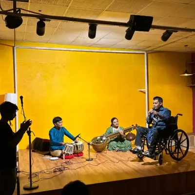 A wide shot of our stage during an inclusive classical music night. The warm lighting, professional sound setup, and engaged audience show how our space transforms into an intimate performance venue.
