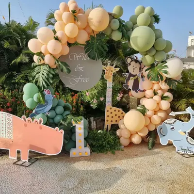 We are so happy that big birthday bashes for little kids are back. We love creating fun themes like this "Wild & Free" setup, complete with adorable animal cutouts and balloon arrangements.