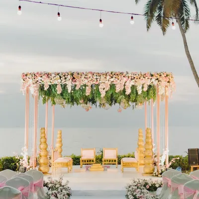 A dream destination wedding mandap in Goa. This setup by the sea, with its lush floral canopy and elegant seating, created an unforgettable backdrop for the vows.