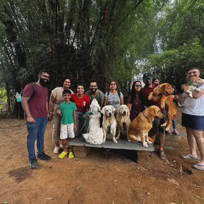 Group photos from a 'Dog's Day Out' at an organic farm. It's amazing to see so many people and dogs of different breeds enjoying a day in nature together.