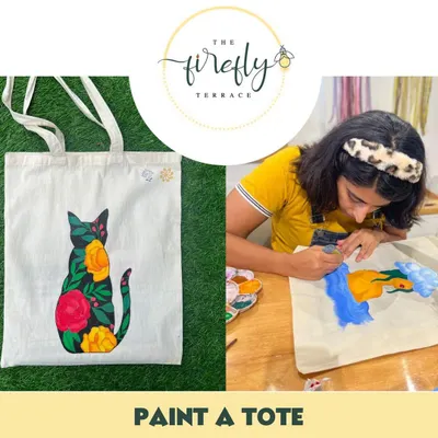 Why buy a printed tote when you can paint your own? This image shows a finished floral cat design next to an artist creating their own masterpiece. My tote bag painting kits come with a canvas bag and all the paints you need to wear your art.