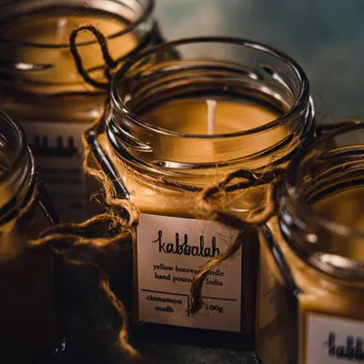 My yellow beeswax candles are hand-poured into beautiful glass jars and tied with jute string. This Cinnamon Oudh scent is warm and comforting, perfect for creating a relaxing atmosphere at home.
