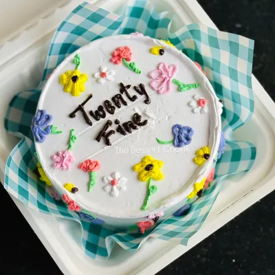 A "Twenty Fine" bento cake with cute, colourful, hand-piped flowers. These Korean-style lunchbox cakes are perfect for a trendy and personal celebration.