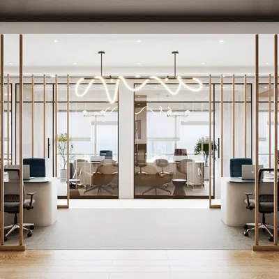 The entrance to our Japandi-style office project in Mulund features a striking wooden slat partition. This element maintains the open, airy feel required by Vastu principles while adding a sophisticated architectural detail.