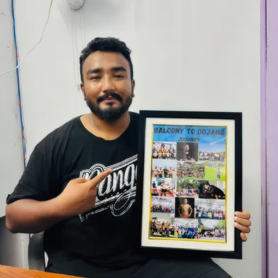 This gift means the world to me. A framed collage showing our journey from my balcony to our current gyms. It's a constant reminder of how far we've come and how much further we have to go.