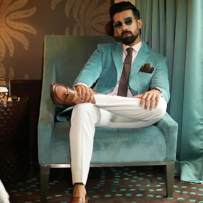 Our aqua corduroy blazer, styled for a relaxed yet polished look. The textured fabric adds a tactile dimension, making it a unique piece that transitions effortlessly from a business lunch to an evening out.