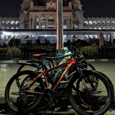 Our cycles parked in front of the magnificent Vidhana Soudha at night. Exploring Bangalore's landmarks after dark, when they are beautifully lit and free of crowds, is a core part of our rides.